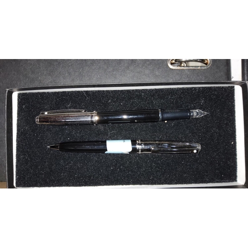 154 - A Sheaffer 300 Series chrome and black fountain pen and ball point pen