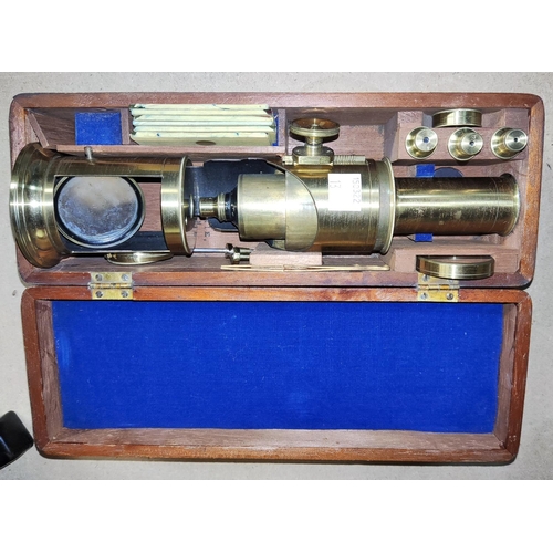 13 - A field microscope in mahogany case, with spare lenses and slides, etc., by Lennie Edinburgh