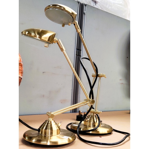 44 - Two modern gilt metal standard lamps; 2 similar table / reading lamps