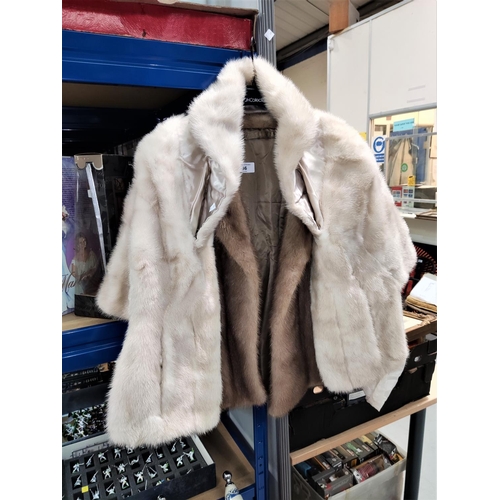 36 - A ladies mink jacket; a blonde wrap