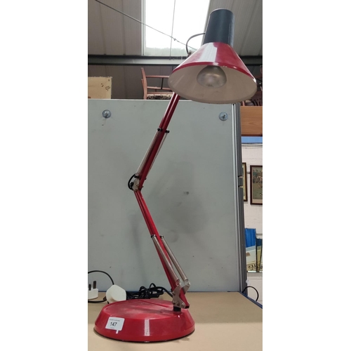 147 - A red angle poise lamp