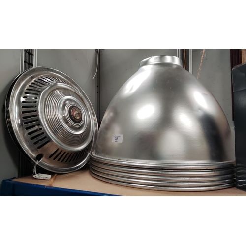 32 - Five large industrial light shades in silvered metal; 2 vintage chrome hub caps