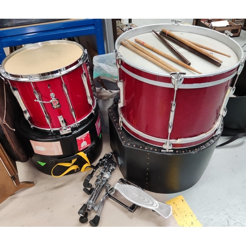 42 - A drum kit including base and side drums with boxes; pedals; sticks; etc.