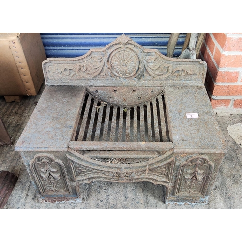 2 - A cast iron fireplace with grate