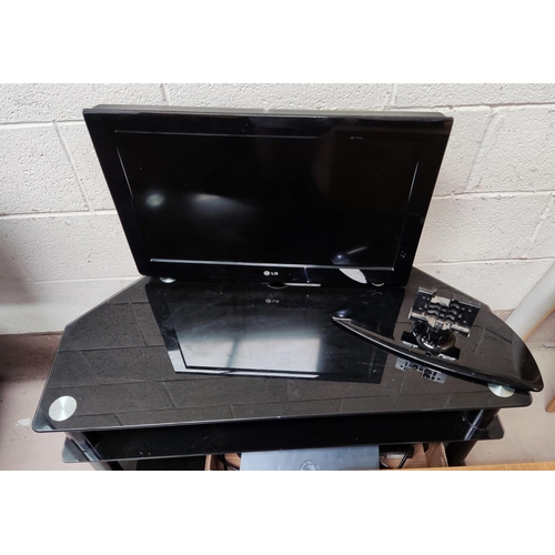 31 - An LG 66 cm flat-screen TV with DVD player with stand