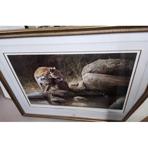 32 - A limited edition print of a leopard by D P Hierrve, framed and glazed; a rectangular gilt framed wa... 