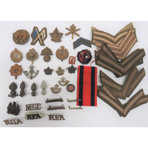 Selection of Various Badges cap badges include brass RMLI ... Brass KC MGC ... Brass, KC RFC ... Brass, KC Royal Fusiliers ... Darkened, KC Canada Forces ... White metal Ox & Bucks LI ... Plastic economy, KC General List ... Brass KC ASC. Collars include darkened, KC 49th Canada (no fitting) ... 2 x darkened, KC Canada Forces ... Bronzed RA. Titles include 2 x darkened Canada ... Brass MGC ... Small selection of braid NCO's rank.