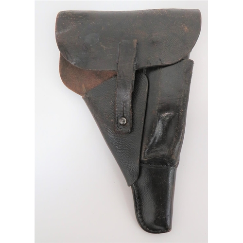 WW2 German P38 Auto Pistol Leather Holster
black, pebbledash, leather holster.  Front spare magazine pouch. Rear with two belt loops.  Maker stamped "CXB" with eagle and swastika, also "P38".  Some wear.  