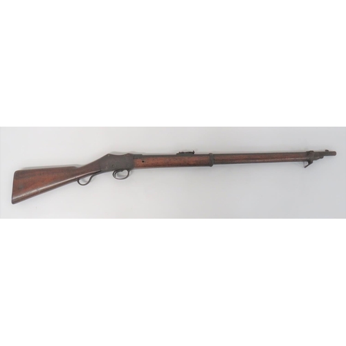 Obsolete Martini Commercial Rifle by "BSA"
.577/450, 30 1/2 inch barrel.  Top ladder sight.  Breech stamped with "BSA" logo.  Flat side body with traces of edge line engraving.  Steel trigger guard and short operating lever.  Polished wooden butt with steel butt plate.  Polished, full stock woodwork secured by two steel barrel bands, the front one with side mounted bayonet bar.  Steel end cap.  Steel now with dark patina. 