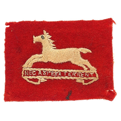 West Yorkshire cloth pagri badge.  Good scarce red felt rectangle embroidered in white with running horse on scroll NEC ASPERA TERRENT. Each corner with pinhole from being attached to pagri.   .  . GC