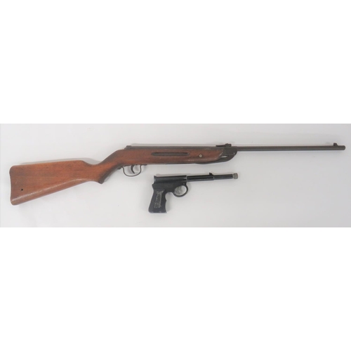 Two Vintage Air Guns
consisting "Diana" Mod 25, .177 air rifle.  15 3/4 inch, hinged barrel.  Rear, tubular spring housing with maker's details.  Steel trigger guard.  Polished, wooden half stock.  Together with a "GAT" air pistol.  Push in loading barrel.  Blackened cast body, frame and checkered grips.   Body marked "T J Harrington & Son" "The GAT".  2 items.