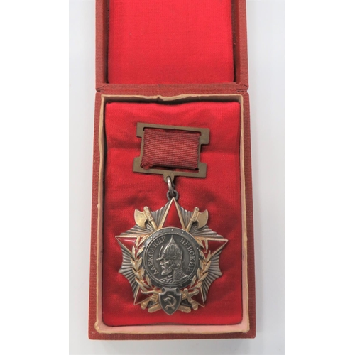 Russia Soviet Order Of Alexander Nevsky
fine silver, gilt and red enamel example on the short style, Soviet ribbon bar.  Reverse with engraved award number "1832".  Contained in a padded card box.  