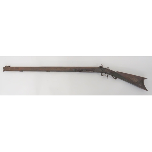 Mid 19th Century Left Hand Target Rifle by "Marston" 
80 bore, 33 inch rifled, octagonal barrel.  Front tube sight.  Lower ramrod rib.  Long tang breech plug.  Left hand lock plate with foliage scroll engraving and maker "Wm. P Marston".  Dolphin percussion hammer with matching engraving.  Polished, half stock woodwork with checkered wrist.  Cheek piece to the right side.  Heavy steel, curved butt plate.  Steel patch box to the left side. Steel scroll trigger guard, ramrod pipes and ramrod.  Mainspring absent.  Steel with some rusting.  Attic find condition.