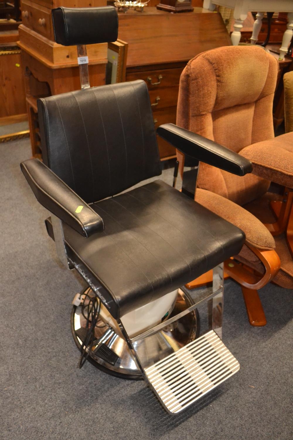 Electric barber's chair tested and in working order.