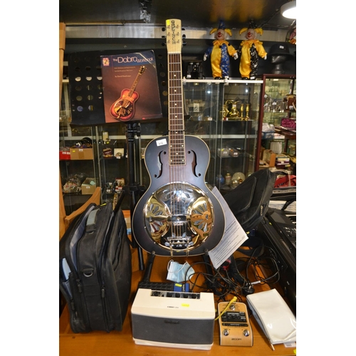 Gretsch G9230 Resonator Guitar with Fishman pickup - 2 years old, hardly used - with spare strings, tone bar, finger picks, soft travel case & shoulder strap heavy duty music stand and case with 13 music books