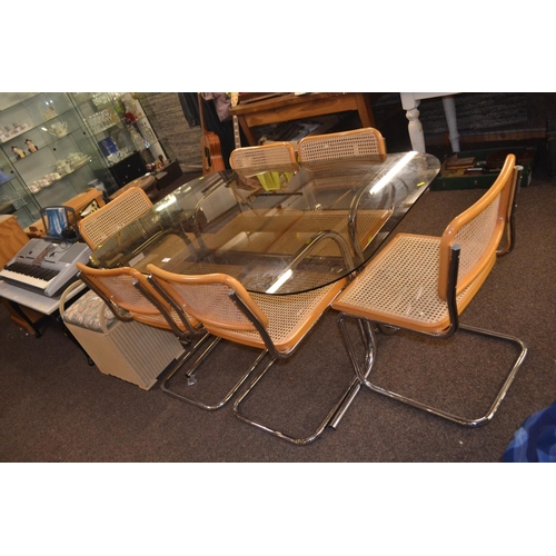 After Marcel Breuer, six model Cesca chairs, on chrome cantilever bases, made in Italy with glass topped rattan table 152.5cm length, 91cm wide