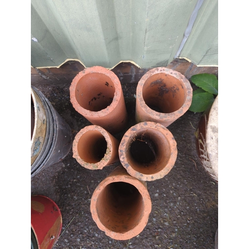 19 - 5 terracotta pipe style forcers. H31cm.