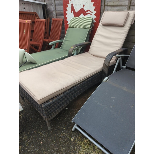 35 - Rattan garden sun lounger, with glass topped side table & cushions