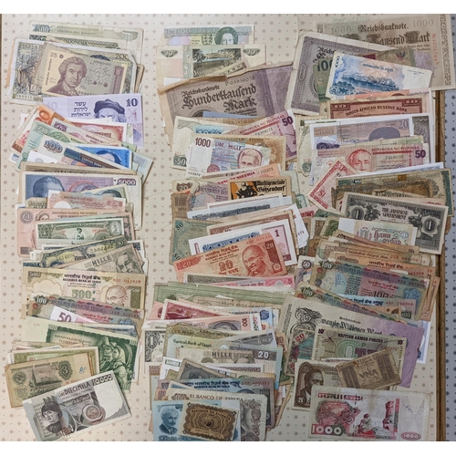 42 - Banknotes; a very mixed bundle of foreign (i.e. non-UK) notes from a wide variety of countries. Mixe... 