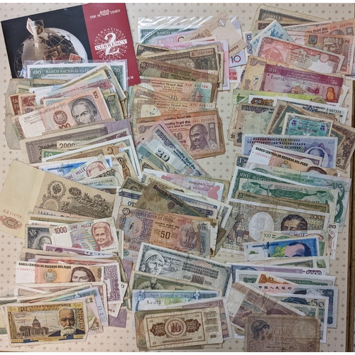 44 - Banknotes; a very mixed bundle of foreign (i.e. non-UK) notes from a wide variety of countries. Mixe... 