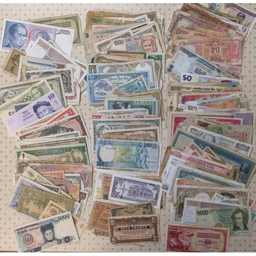 45 - Banknotes; a very mixed bundle of foreign (i.e. non-UK) notes from a wide variety of countries. Mixe... 