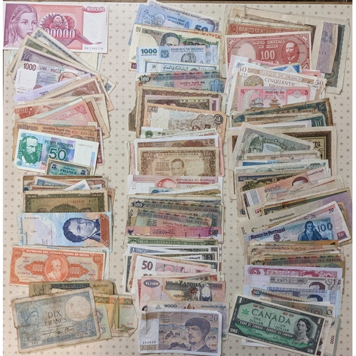 48 - Banknotes; a very mixed bundle of foreign (i.e. non-UK) notes from a wide variety of countries. Mixe... 