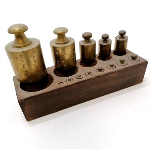 25 - Antique set of brass weights set in a wooden block, (smallest missing) Blundell slide rule in case, ... 