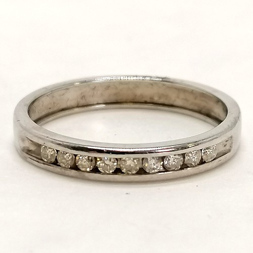 262 - 9ct marked white gold half eternity ring channel set with 9 diamonds - size M½ & 2g total weight