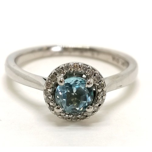282 - 9ct hallmarked white gold diamond & blue topaz stone set cluster ring - size N½ & 2.6g total weight