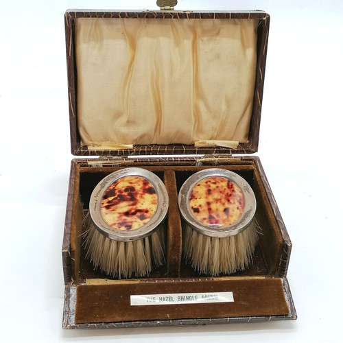403 - Original cased pair of silver clothes brushes with styled detail - box 14cm x 10cm x 5.5cm
