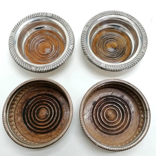 532 - 2 pairs of silver plated wine coasters with wooden bases (1 pair Sheffield plate 13.5cm diameter but... 