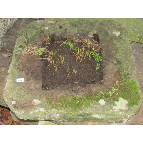2032 - A weathered natural stone drain cap/surround with canted corners, 67 cm square x 10 cm thick approx