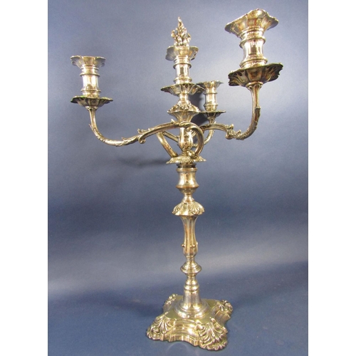 1 - A good quality Sheffield plate three branch candelabra with rococo styling of scrolled acanthus bran... 