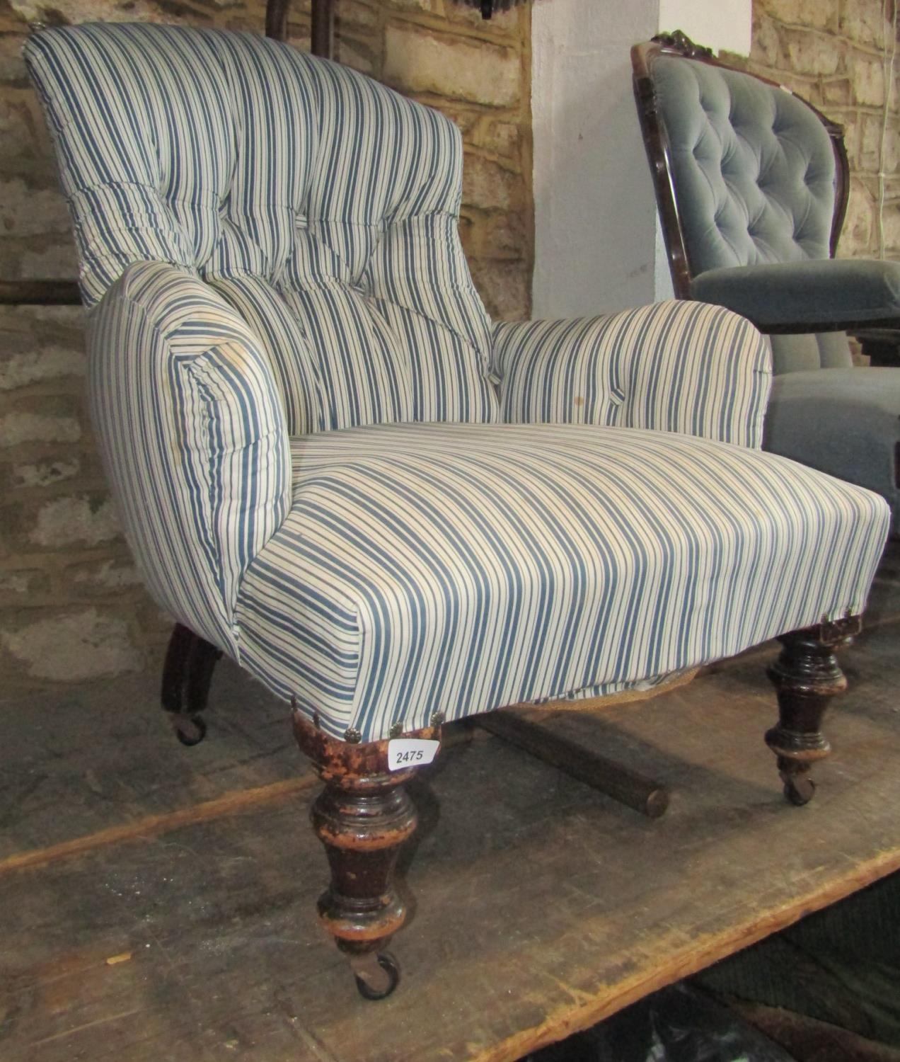 A Victorian button back drawing room chair with blue and white striped