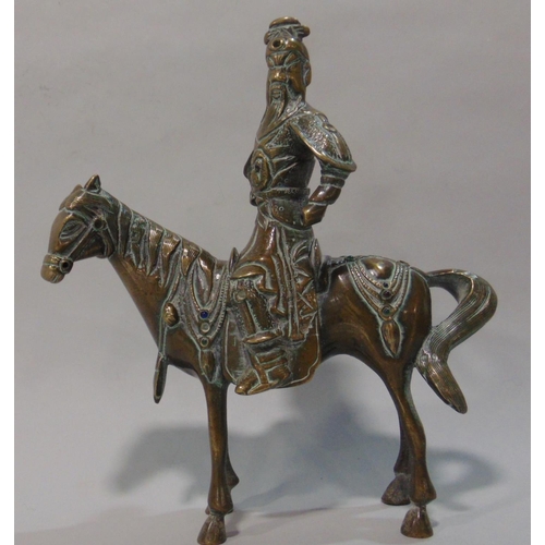738 - Japanese bronze figural study of a Samurai type warrior on horseback, fitted with various colourful ... 