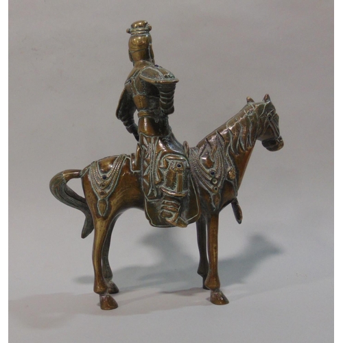 738 - Japanese bronze figural study of a Samurai type warrior on horseback, fitted with various colourful ... 
