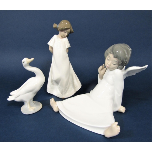 21 - A Lladro Daisa figure of a seated angel, together with a Lladro figure of a goose and a Nao figure o... 