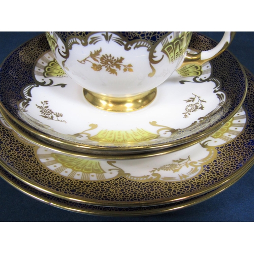 29 - A collection of Tuscan china teawares with blue and gilt decoration comprising pair of cake plates, ... 