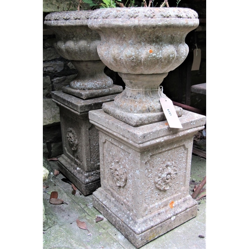 1514 - A pair of reclaimed garden planters, probably Sandford stone with flared repeating flowerhead rims, ... 