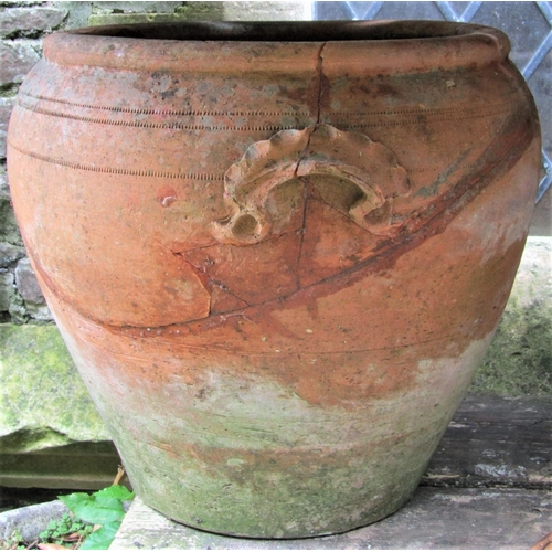 1517 - A small weathered clay chimenea, a ewer with glazed interior, a pair of matt glazed oviform jars wit... 