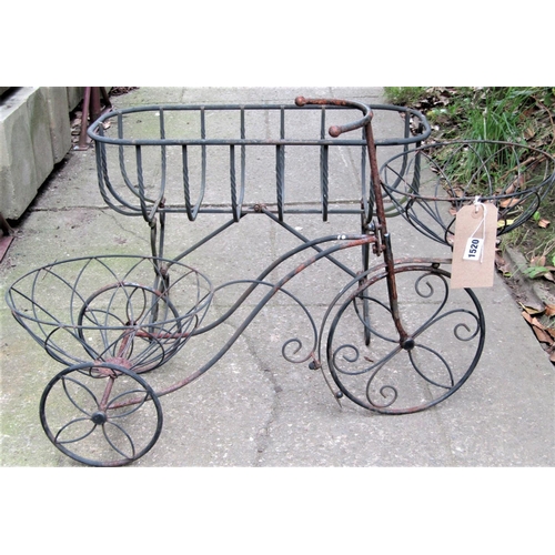1520 - A small novelty light steel and wirework garden planter in the form of a tricycle, together with a f... 