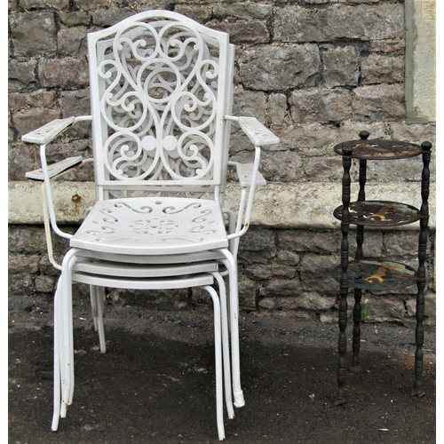 1557 - A set of four cream painted tubular steel framed and moulded plastic overlaid garden open armchairs,... 
