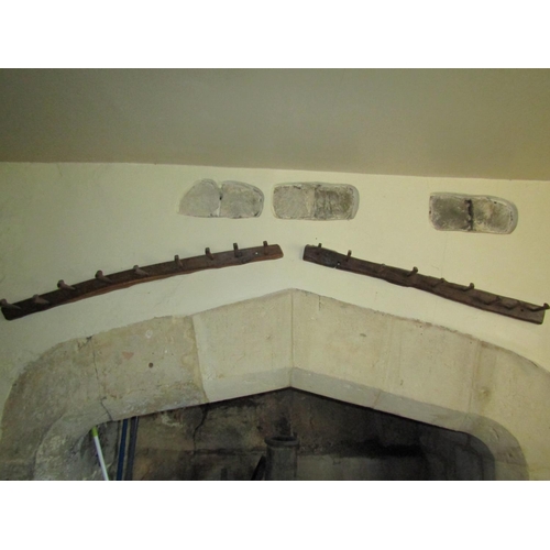 209 - Pair of Old English oak peg hooks, 130cm long