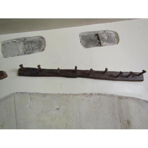209 - Pair of Old English oak peg hooks, 130cm long