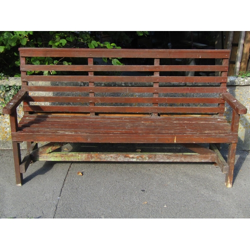 2013 - A stained soft wood three seat garden bench with slatted framework, 166 cm long