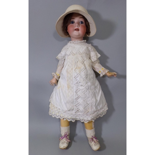 51 - Large German bisque head doll circa 1920's with closing blue eyes, open mouth with teeth and jointed... 