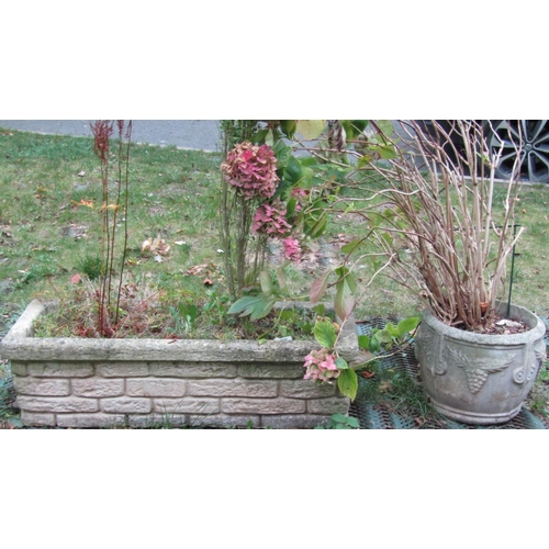2028 - A reclaimed garden planter of rectangular form with simulated stone wall facade, 105 cm long x 36 cm... 