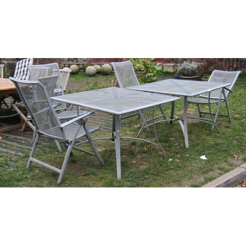 2038a - Two garden tables with grill tops raised on swept supports together with four folding chairs