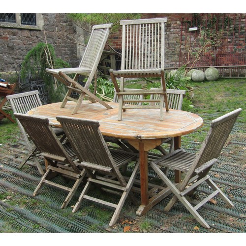 2031 - A weathered hardwood D end and extending garden table, the slatted panelled top with two additional ... 