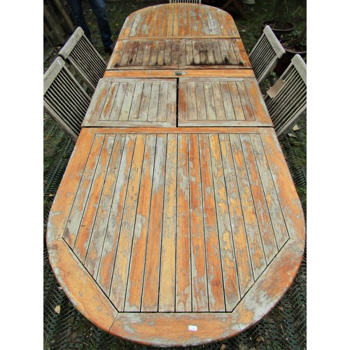 2031 - A weathered hardwood D end and extending garden table, the slatted panelled top with two additional ... 